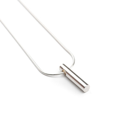 A close up image of the Long Cylinder Pendant