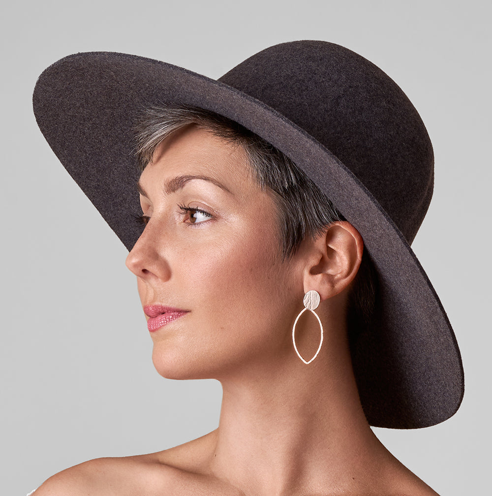 An image of the Pointed Oval Petal Earrings worn on the body