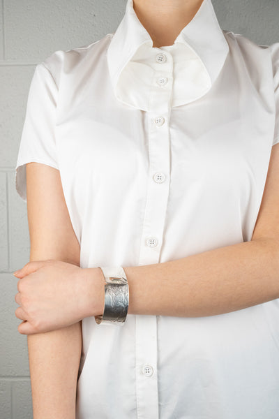 An image of the Clip Bangle worn on the body