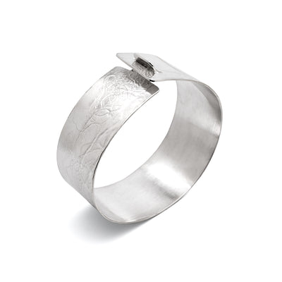 A close up image of the Clip Bangle with a lichen imprint