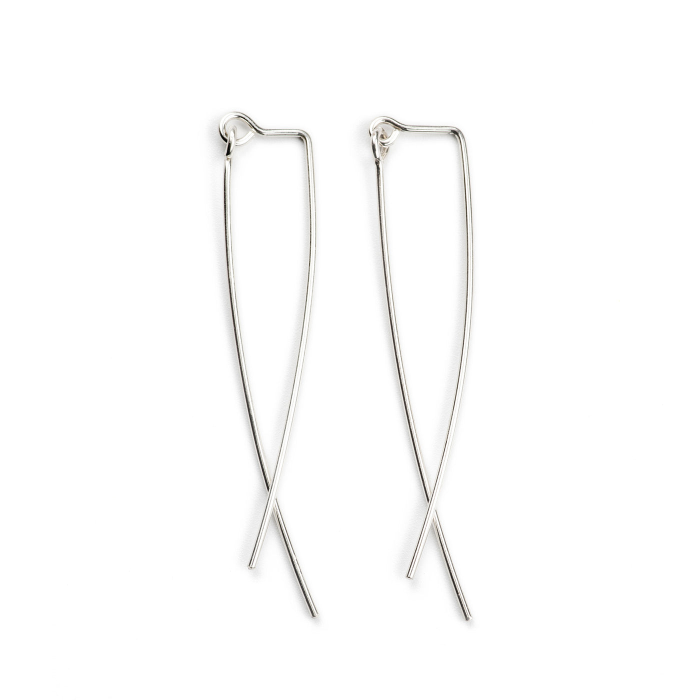 A close up image of the Curved Dangleback earrings