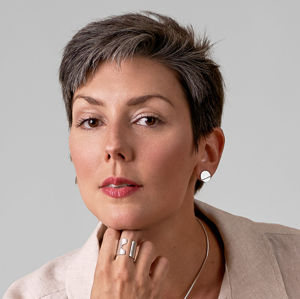 An image of the White Gold Textured Disc Studs worn on the body