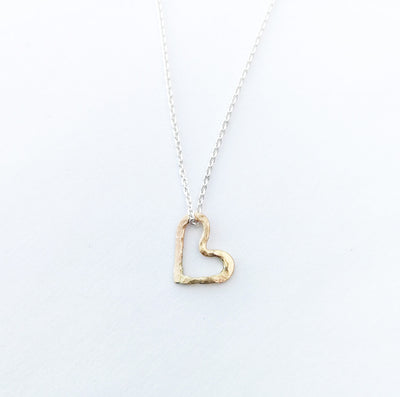 A close up image of the gold Openhearted Pendant