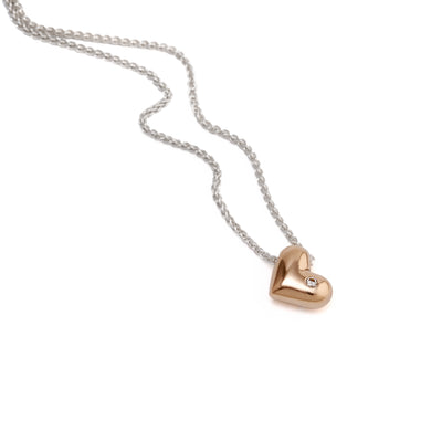 An image of the Gold Solid Heart Pendant with a Diamond