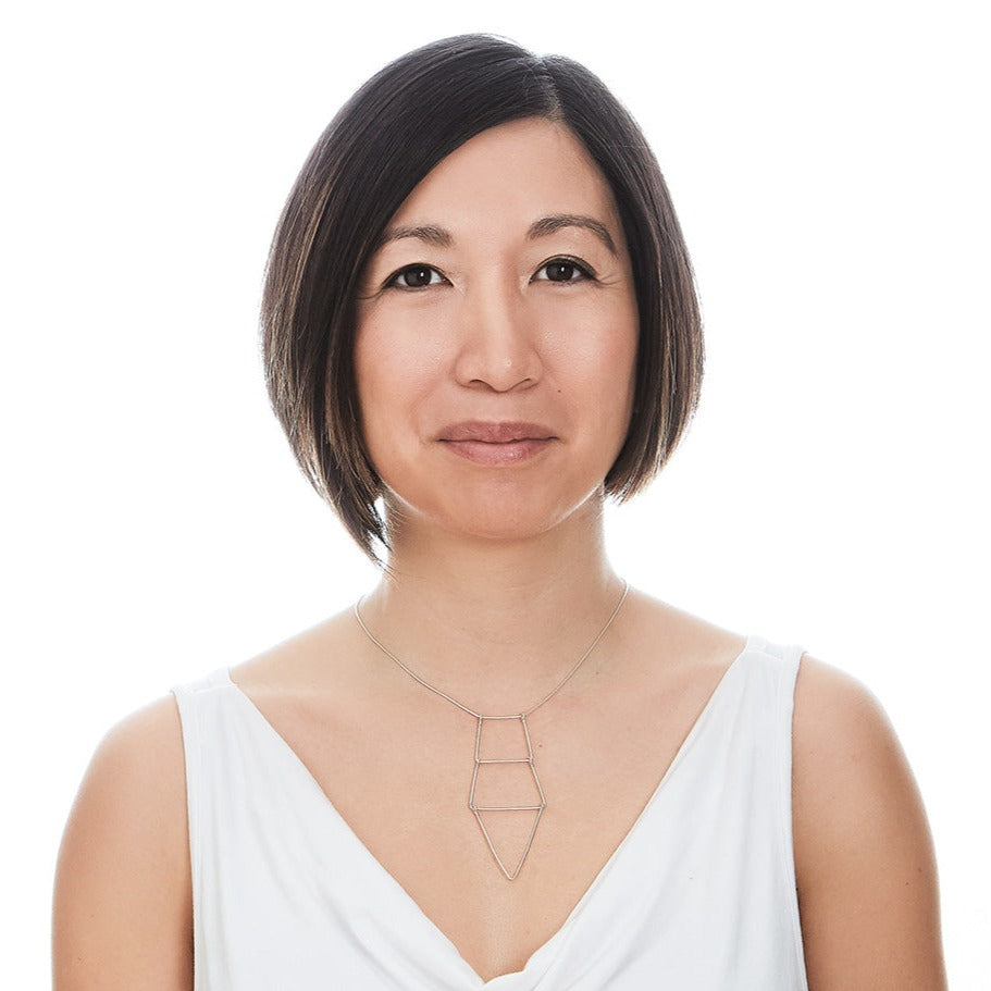 An image of the Kinetic Ladder Pendant worn on the body
