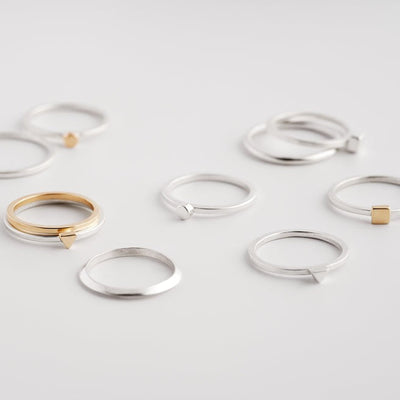 An image of multiple Everyday Bands and Tiny Rings scattered on a surface