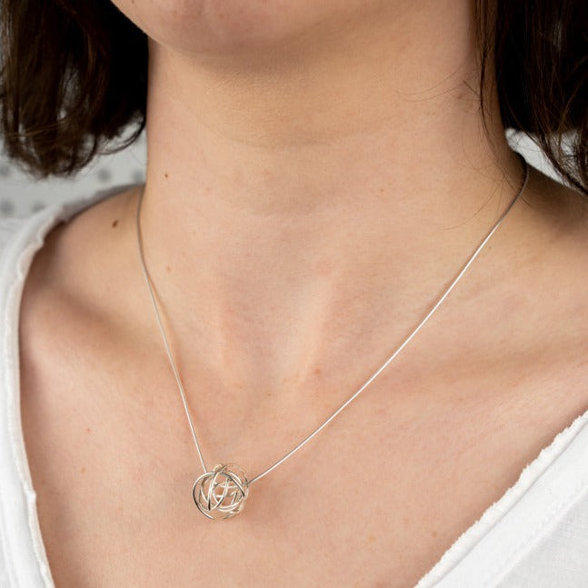 An image of the silver Scribble Bead Pendant worn on the body