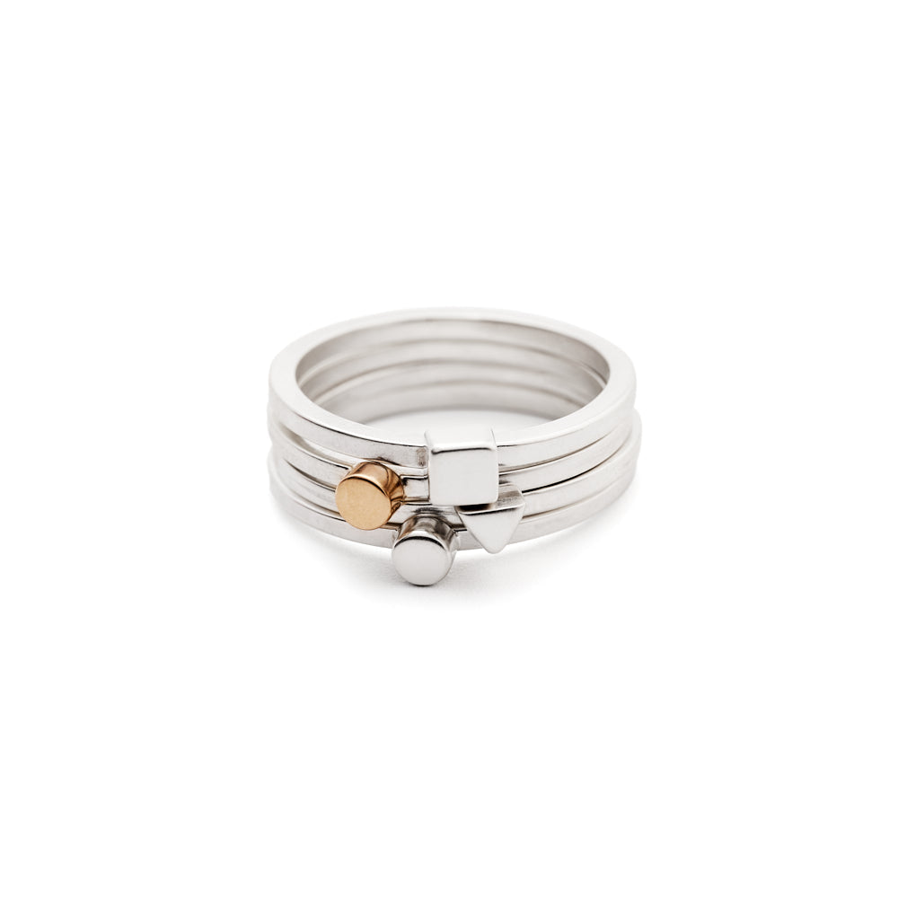 An image of the Tiny Ring with Dot in Silver and Gold stacked with Tiny Rings in Silver