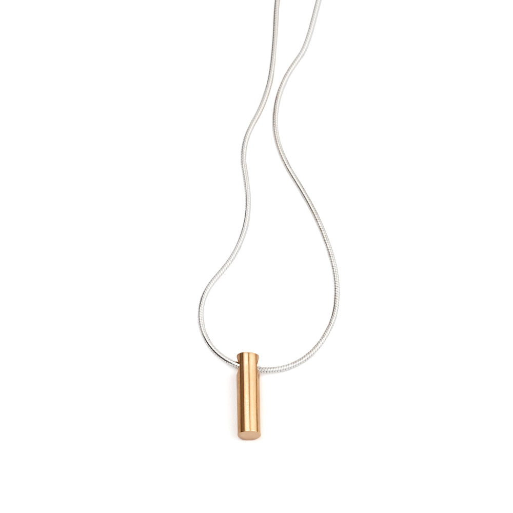 An image of the Long Cylinder Pendant in gold